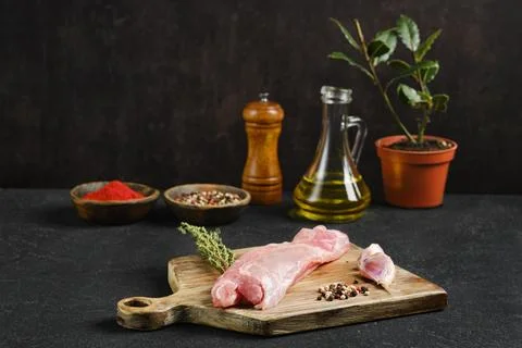 Culinary preparation with fresh rabbit meat and spices on a kitchen counterto Stock Photos