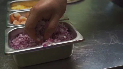 Culinary Preparation Hand Taking Chopped Onion from Bowl Stock Footage 293252214