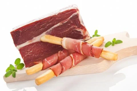 Culinary prosciutto background. Stock Photos