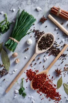 Culinary still life of assorted spices on white textured background, flat lay Stock Photos