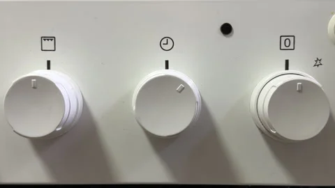 Culinary Waiting: Gas Stove Timer Twists with Sharp Mechanical Ticking Stock Footage 328795983
