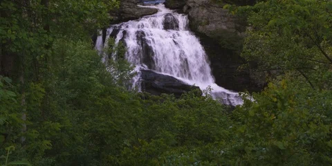 Cullasaja Falls flowing through the rocks in the forest of NC Stock Footage 103818682