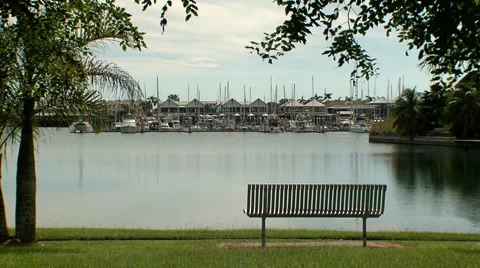 Cullen bay marina with park bench Video stock 1079007