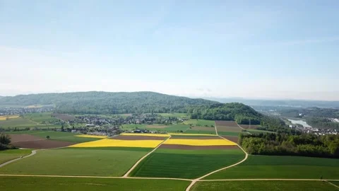 Cultivated fields creating a colorful patchwork across landscape in Habsburg Video stock 292952505