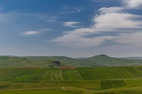 Cultivated fields in mountains Stock Photos