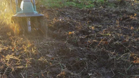 Cultivating plot with garden tiller Stock Footage 71085897