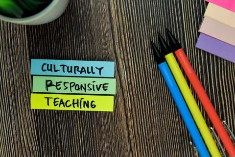 Culturally Responsive Teaching write on sticky notes isolated on Wooden Table Stock Photos