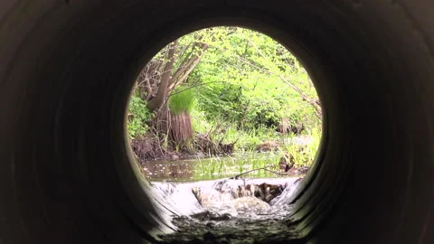 Culvert- Water Pipes Under Road and a view from inside Stock Footage 239719743