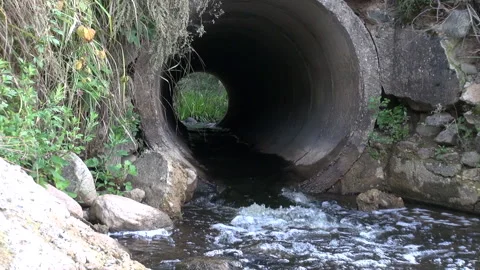Culvert- Water Pipes Under Road and a view from outside Stock Footage 239720570