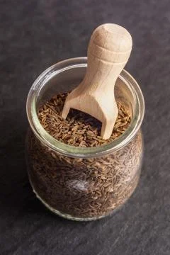 Cumin seeds on stone table Stock Photos