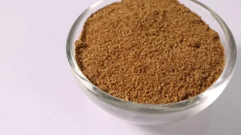 Cumin spice whole powdered in mini glass bowl pan rotate Stock Footage 249297805