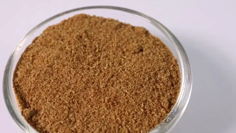 Cumin spice whole powdered in mini glass bowl pan rotate Stock Footage 249297815