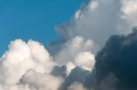 Cumulonimbus cloud developing on a blue sky Stock Photos