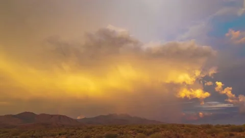 Cumulonimbus cloud time lapse during sunset, over the four peaks mountains in AZ Stock Footage 139784998
