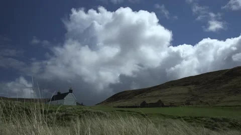 Cumulonimbus clouds  over a cottage Stock Footage 158178193
