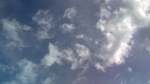 Cumulous clouds moving in time-lapsed motion give way to diffuse vapor Stock Footage 147844976
