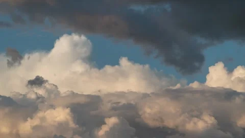 Cumulus and cirrus clouds move rapidly in the sky. Time lapse Stock-Footage 296273545
