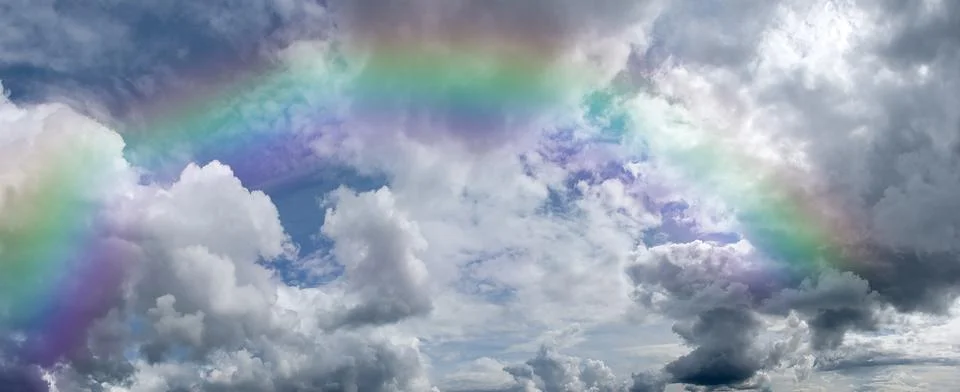 Cumulus cloud rainbow Stock Photos