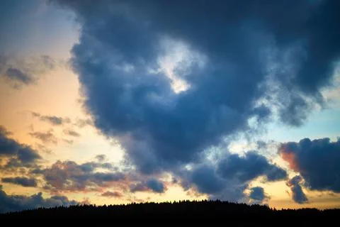 Cumulus cloud shaped heart on sky. Evening sunset. Symbol of love. Nature Stock Photos