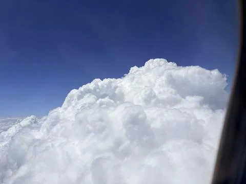 Cumulus Clouds Against a Deep Blue Sky Stock Photos