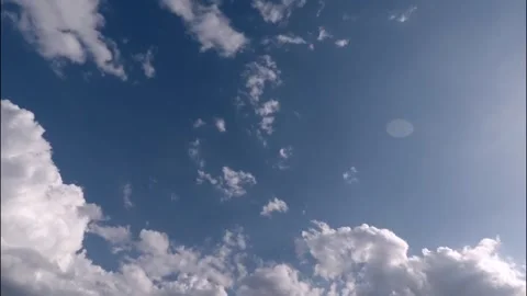 Cumulus Clouds and Deep Blue Sky on a Sunny Day Stock Footage 295742492
