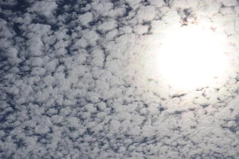 Cumulus clouds and sun Stock Photos