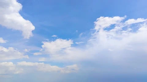 Cumulus clouds are fluffy and white against a blue sky Stock Footage 308641276