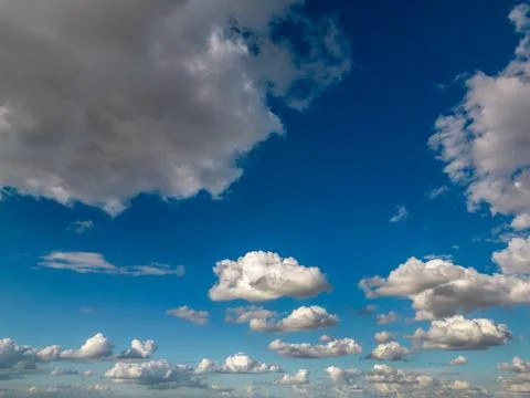 Cumulus Clouds on Blue Sky Background Stock Photos