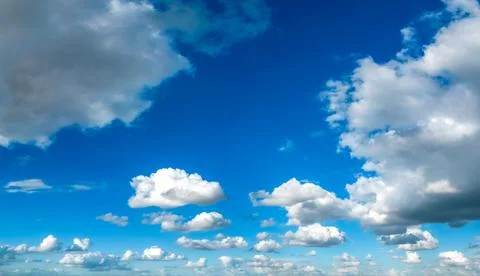 Cumulus Clouds on Blue Sky Background Stock Photos
