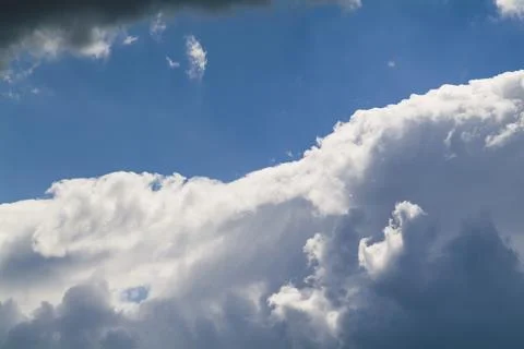 Cumulus clouds in the blue sky. No land view. Stock Photos