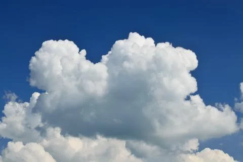 Cumulus clouds on blue sky Stock Photos