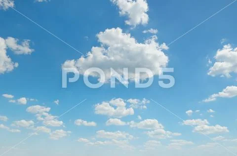 Cumulus clouds in the blue sky Stock Photos