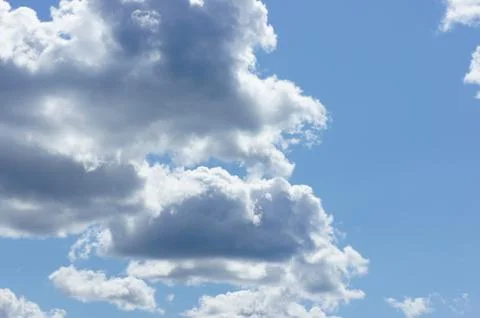 Cumulus clouds in a blue sky. Stock Photos