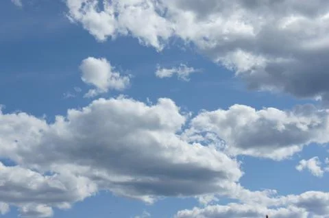 Cumulus clouds in a blue sky. Stock Photos