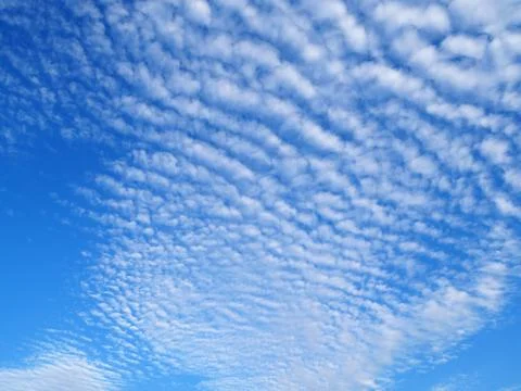 Cumulus clouds in blue sky Stock Photos