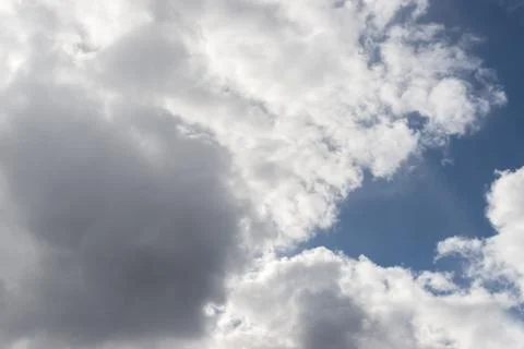 Cumulus clouds in a blue sky. Stock Photos