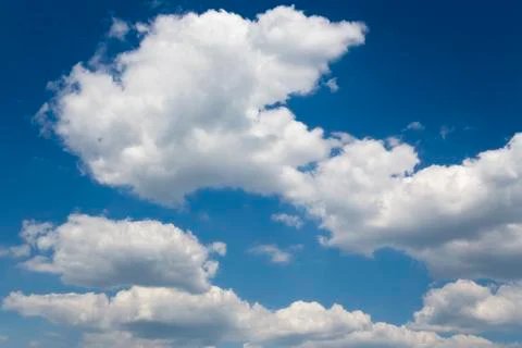 Cumulus clouds in the blue sky Stock Photos