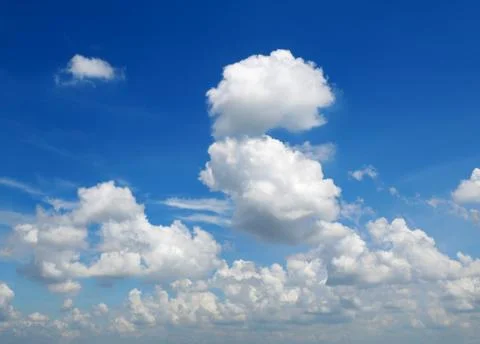 Cumulus clouds in the blue sky Stock Photos