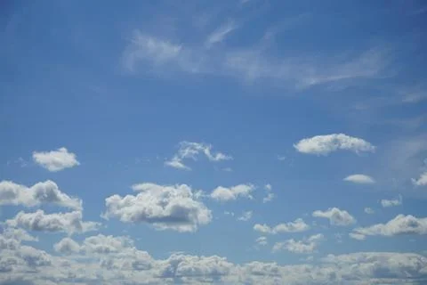 Cumulus clouds in a blue sky. Stock Photos