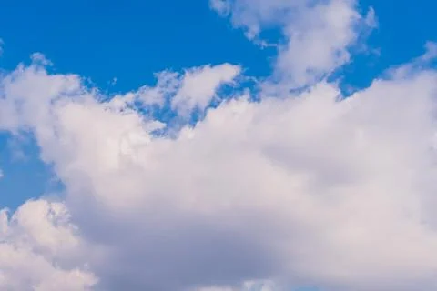 Cumulus clouds in blue sky. Stock Photos