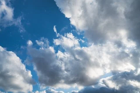 Cumulus clouds in a blue sky Stock Photos