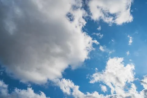 Cumulus clouds in a blue sky Stock Photos