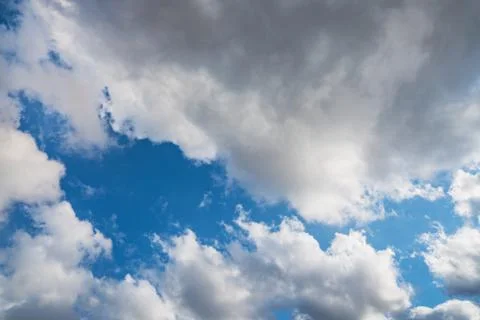 Cumulus clouds in a blue sky Stock Photos