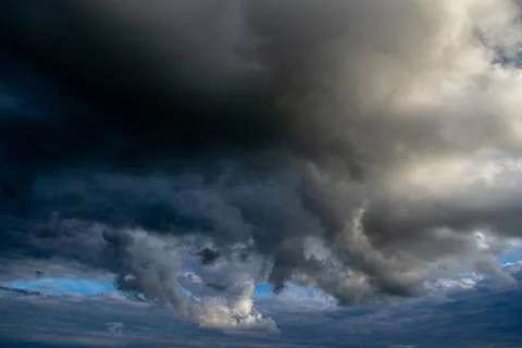 Cumulus clouds in a blue sky. Stock Photos