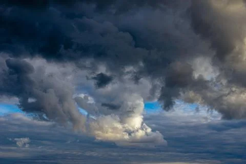 Cumulus clouds in a blue sky. Stock Photos