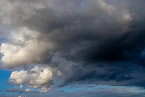 Cumulus clouds in a blue sky. Stock Photos