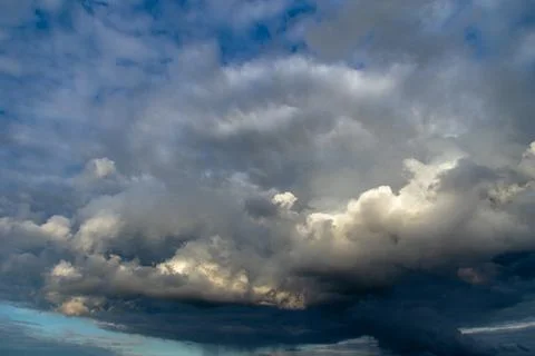 Cumulus clouds in a blue sky. Stock Photos