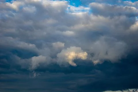 Cumulus clouds in a blue sky. Stock Photos