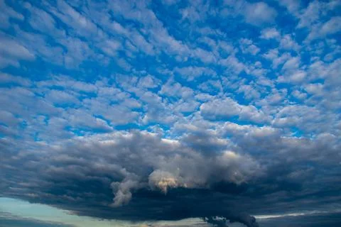 Cumulus clouds in a blue sky. Stock Photos