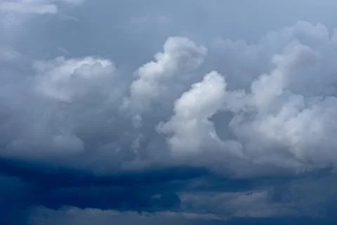 Cumulus clouds in a blue sky. Stock Photos